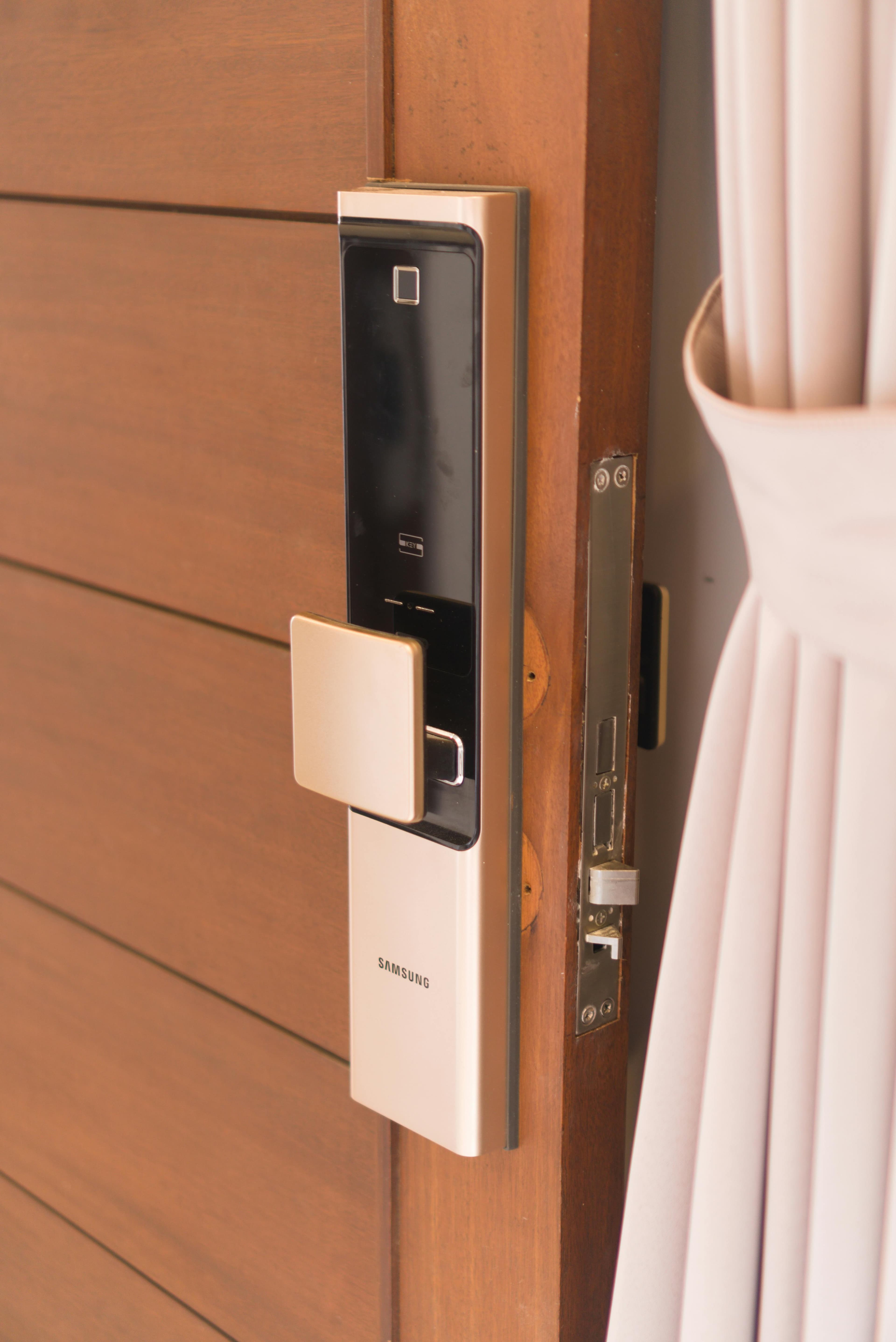 Close-up of a premium smart lock on a wooden door