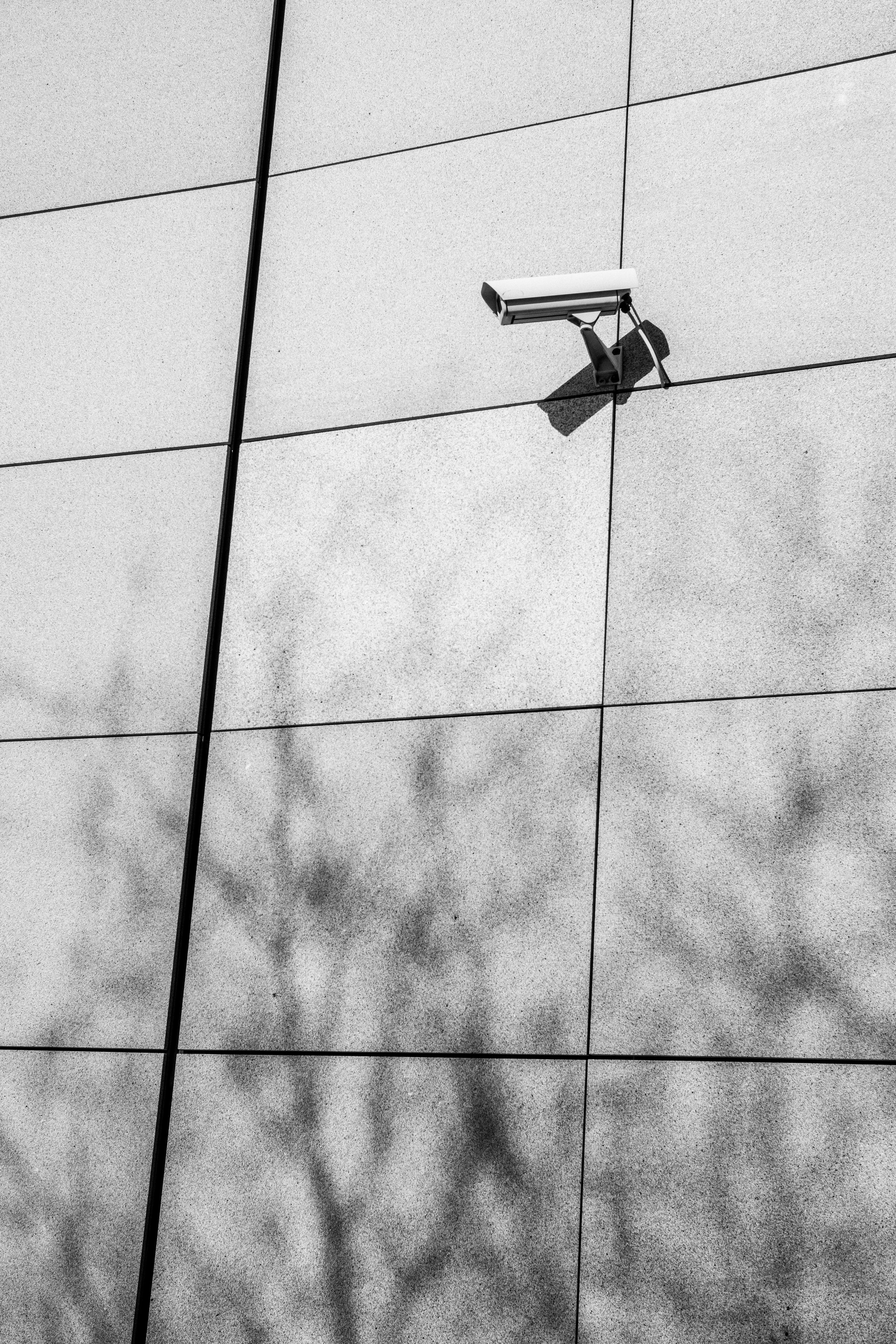 Security camera installed on a modern building exterior